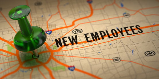 New Employees Concept - Green Pushpin on a Map Background with Selective Focus.