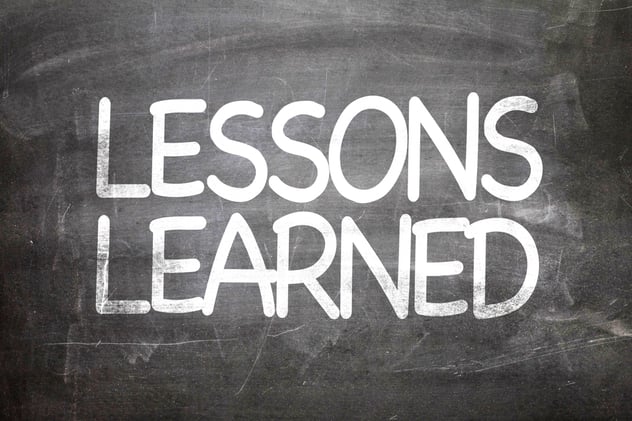 Lessons Learned written on a chalkboard