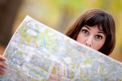 Lost woman holding a map